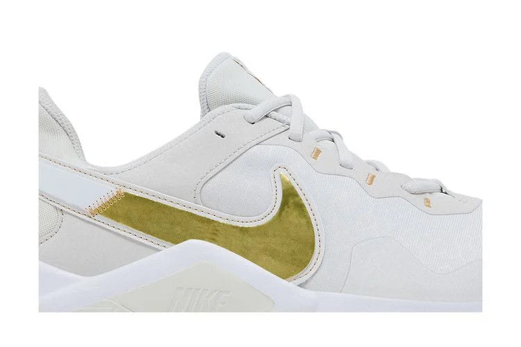 Krossovki-Nike-Wmns-Legend-Essential-2-Platinum-Tint-Metallic-Gold-Star-1