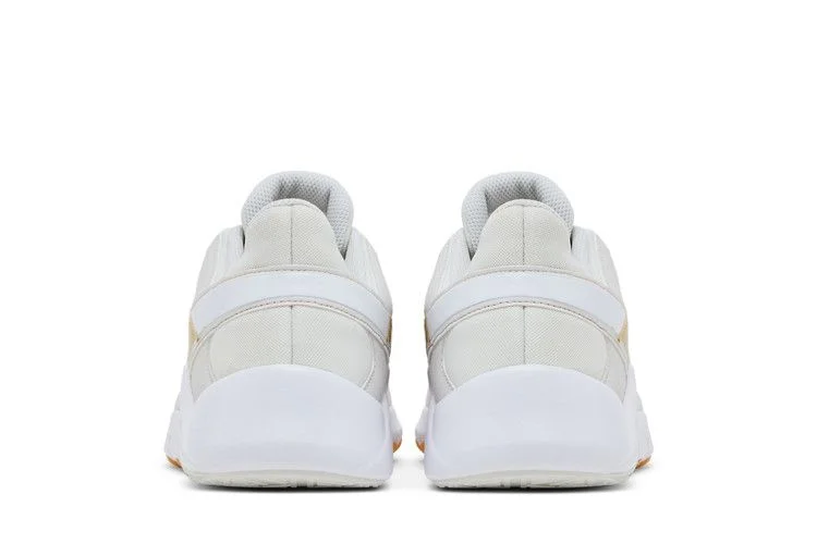Krossovki-Nike-Wmns-Legend-Essential-2-Platinum-Tint-Metallic-Gold-Star-5