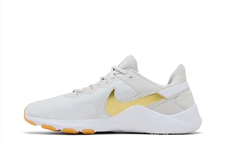 Krossovki-Nike-Wmns-Legend-Essential-2-Platinum-Tint-Metallic-Gold-Star-2